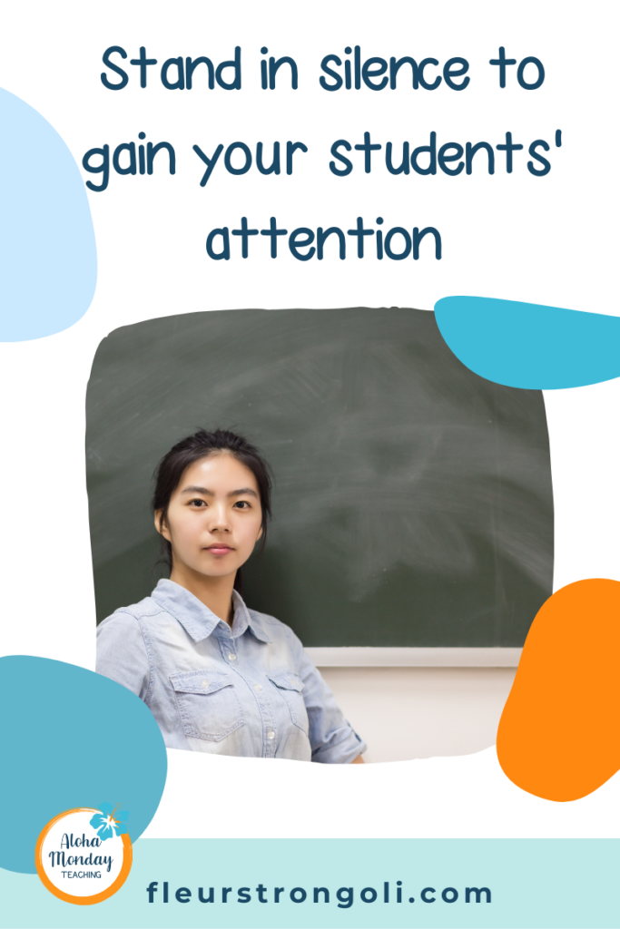 Stand in silence to gain your students' attention
