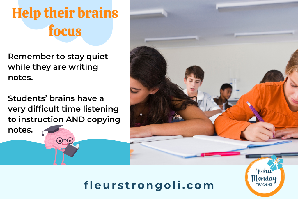 image of students working at their seats; help their brains focus: remember to stay quiet while they are writing notes. Students' brains have a very difficult time listening to instruction AND copying notes.